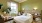 a bedroom with a bed and a desk
