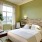 a bedroom with a bed and a desk