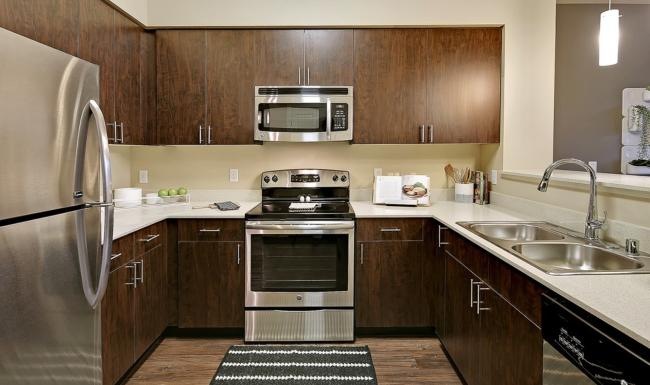 a kitchen with wooden cabinets