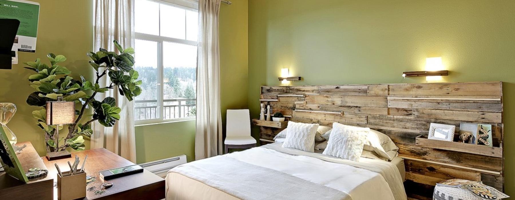 a bedroom with a bed and a desk