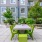 a table and chairs outside a building